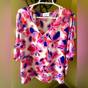 Floral Shirt with blues and pinks on white background.